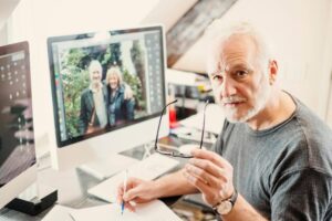Senior Male in front of his home computer