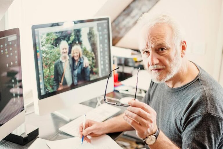 Senior Male in front of his home computer
